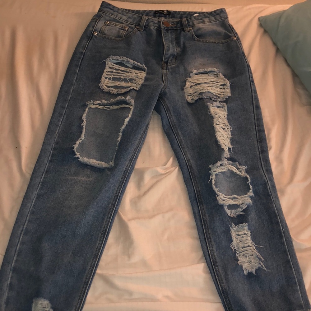Distressed medium blue jeans